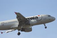 N346NB @ KSNA - NWA A319 lifting off with a heavy load - by Mike Khansa