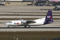 N712FE @ KMIA - FEDEX F27 - by Andy Graf-VAP