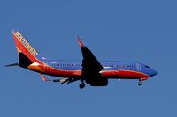N421LV @ KSNA - Southwest B737-7H4 on short final. - by Mike Khansa
