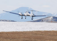 N943ES @ KAPA - Landing on 17L with Pikes Peak in the Distance. - by Bluedharma