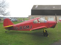 G-BGMJ @ EGSP - Minicab outside the hangar at Sibson
