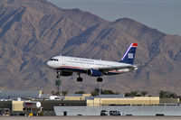 N665AW @ KLAS - US Airways / 2001 Airbus Industrie A320-232 / This landing prompted all McCarran's Emergency Vehicles to stand-by. No mishap occured. - by Brad Campbell