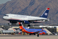 N665AW @ KLAS - US Airways / 2001 Airbus Industrie A320-232 / This landing prompted all McCarran's Emergency Vehicles to stand-by. No mishap occured. - by Brad Campbell