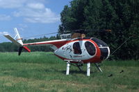 SE-HFT @ ESKB - Hughes 369HS at Barkarby airfield, Stockholm, Sweden - by Henk van Capelle