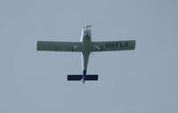 VH-FLX - Flying under storm clouds west bound over the Gold Coast - by aussietrev