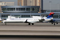 N810SK @ KLAS - Delta Connection - SkyWest / 2006 Bombardier CL600-2D24 - by Brad Campbell