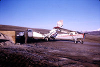 ZK-COV - Loading at Waimate early 1970's - by Craig Powell