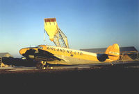 ZK-BUV @ NZGS - Loading at Gisborne 1971 - by Neville Worsley