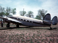 N21G @ KLHX - Taken May 1977 at LaJunta, Colorado. She'd rolled back into a large tank during a bout with high winds and crushed the tail cone. - by Gerry Asher