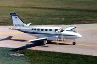 N98599 @ DPA - Photo taken for aircraft recognition training.  Cessna 441 taxiing by the control tower - by Glenn E. Chatfield