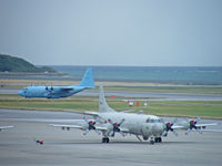 5022 @ ROAH - Lockheed P-3C/Naha (with C-130H 75-1076 taxying in) - by Ian Woodcock