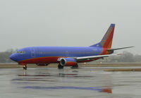 N616SW @ DAL - Southwest Airlines - In the rain at Love Field, Dallas, TX - by Zane Adams