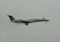 N27506 @ DAL - Continental Express landing in the rain at Love Field - by Zane Adams