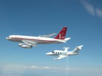 N218JT - Two of John Travolta's planes airborne together - by Unknown