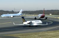 D-ACRB @ EDDL - This CL-600 awaits his turn for take off behind an Air Berlin A320 and Hapag Lloyd 737. - by Joop de Groot