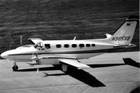 N98599 @ DPA - Photo taken for aircraft recognition training.  Cessna 441 taxiing by the control tower - by Glenn E. Chatfield