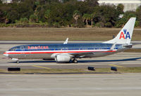 N934AN @ TPA - American B737-800 Series taxies in at Tampa on a fine morning - by Terry Fletcher