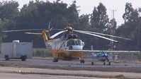 N116AZ @ EDU - Comparing size of Sikorsky with Cessna 152 at EDU - by Reed Maxson