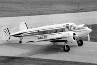 N404T @ DPA - Dick Hansen taxiing by the control tower