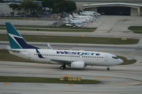 C-FWSV @ KFLL - Boeing 737-700 - by Mark Pasqualino