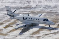 N568CS @ CID - Taxiing below the control tower - by Glenn E. Chatfield