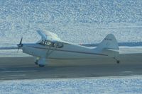 N97183 @ CID - Shot from long distance and into the late afternoon sun - by Glenn E. Chatfield