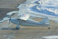 N97183 @ CID - Shot from long distance and into the late afternoon sun - by Glenn E. Chatfield