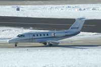 N286MC @ CID - Long-distance shot into the sun, just crossed Runway 13/31 on Alpha