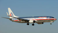 N933AN @ MIA - American B737 lands at close quarters on the cross runway - by Terry Fletcher