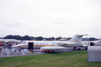 G-LEAR @ EGLF - Learjet at Farnborough. Something hanging under its wing. - by Henk van Capelle