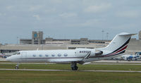N495QS @ PBI - The business aircraft traffic at West Palm Beach on the Friday before President's Day always provides the aviation enthusiast / photographer with a treat - by Terry Fletcher