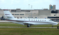 N305EJ @ PBI - The business aircraft traffic at West Palm Beach on the Friday before President's Day always provides the aviation enthusiast / photographer with a treat - by Terry Fletcher