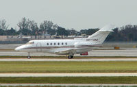 N877DM @ PBI - The business aircraft traffic at West Palm Beach on the Friday before President's Day always provides the aviation enthusiast / photographer with a treat - by Terry Fletcher
