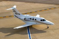 N537RB @ CID - Taxiing below the control tower - by Glenn E. Chatfield