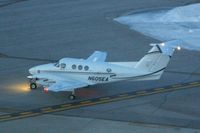 N605EA @ CID - Taxiing to Runway 27 before the sun is up - by Glenn E. Chatfield