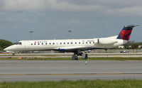 N860MJ @ FLL - Delta Connection Embraer 145 awaits departure from FLL - by Terry Fletcher