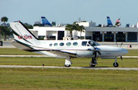 N75HW @ PBI - Cessna 425 taxies in at West Palm Beach - by Terry Fletcher