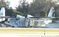 N16ZE @ EVB - This Grumman HU-16E appears to show its age , stuck in the SE corner of New Smyrna Beach airport - by Terry Fletcher
