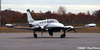 N155RP @ PVG - Secured on the ramp - by Paul Perry
