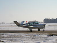 N8428N @ KLVN - Taxiing to Runway 12. - by Mitch Sando