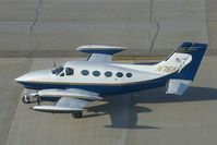 N76KT @ CID - Taxiing out for departure past the control tower - by Glenn E. Chatfield
