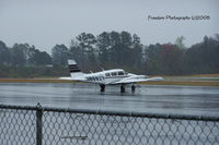 N8692Y @ JNX - Not much going on, it was a very nasty day.  But there was one nice ride on the tar mat. - by J.B. Barbour