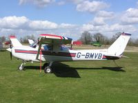 G-BMVB @ EGTN - Cessna 152 sitting in the sun at Enstone