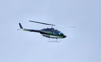 VH-MXW - This copter did a low high speed loop around the hill behind my house. No idea what it was up to.