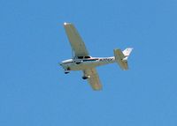N301CF @ SIG - 2002 Cessna 172R Skyhawk, c/n 17281135, In the traffic pattern at SIG, taken from the beach/pool area from my hotel the Caribe Hilton - by Timothy Aanerud
