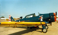 N3166G @ CNW - AT-6 at Texas Sesquicentennial Air Show 1986 - This aircraft was destroyed in a hanger fire at Conroe , TX @ 1994