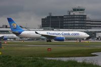 G-OMYT @ EGCC - Taken at Manchester Airport on a typical showery April day - by Steve Staunton