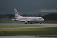 G-OGBE @ EGCC - Taken at Manchester Airport on a typical showery April day - by Steve Staunton