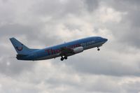 G-THOP @ EGCC - Taken at Manchester Airport on a typical showery April day - by Steve Staunton