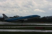 PH-BPB @ EGCC - Taken at Manchester Airport on a typical showery April day - by Steve Staunton
